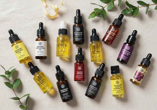 Collection of small bottles of non-comedogenic facial oils